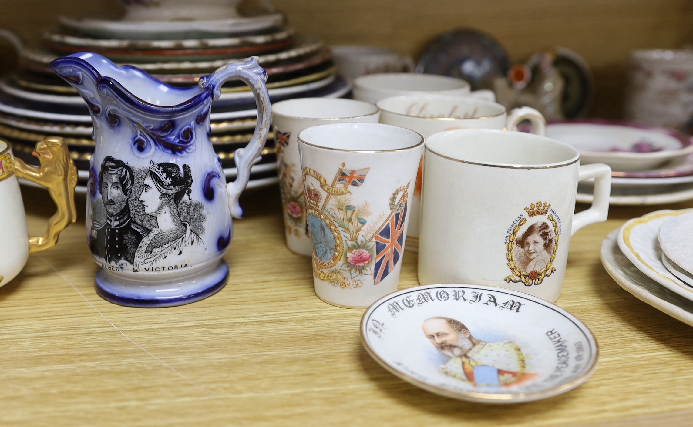 A mixed varied collection of 19th century and later commemorative wares to include a Princess Charlotte lustre cup and saucer, Victoria and Albert nursing plates, cups etc, the largest 25cm in diameter